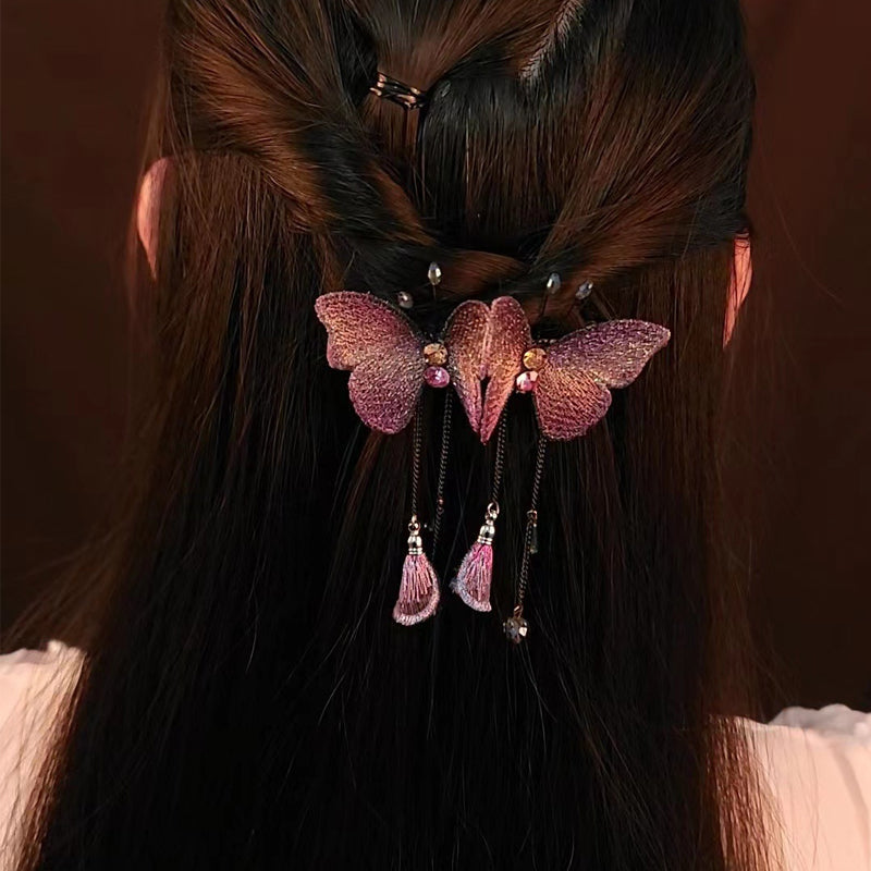 Barrette papillon Ă pompons