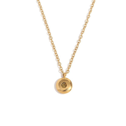 Pendentif délicat en or 18 carats avec pierre de naissance.