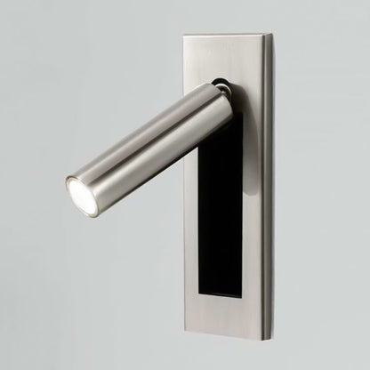 Modern wall-mounted light fixture with a metallic finish on a gray background
