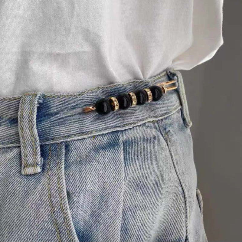 Broche élégante en perle et métal