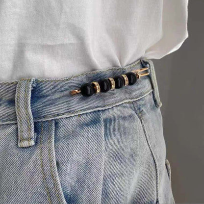 Broche élégante en perle et métal