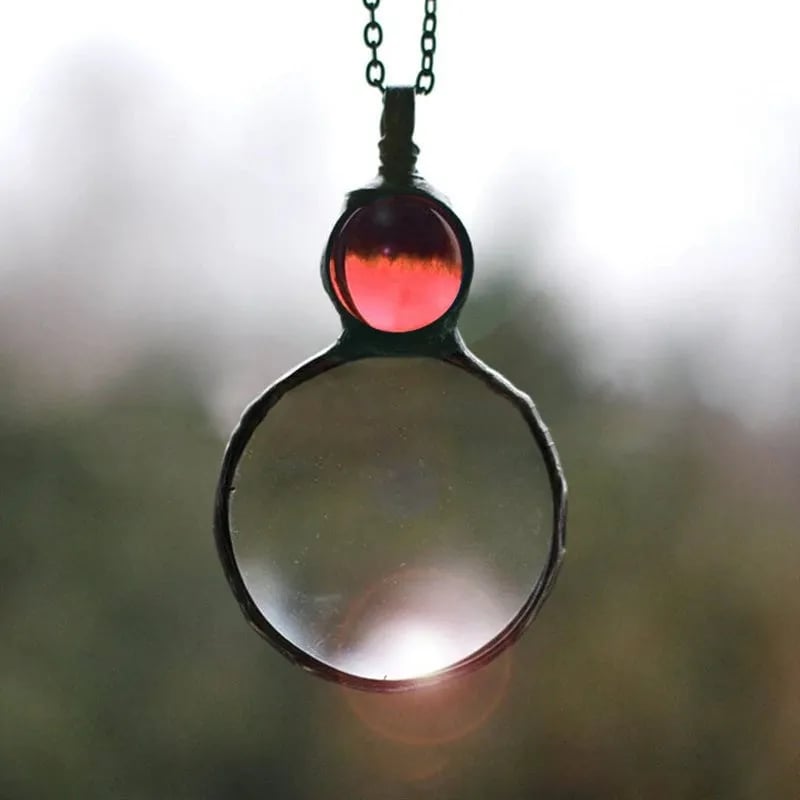 Joli collier pendentif loupe