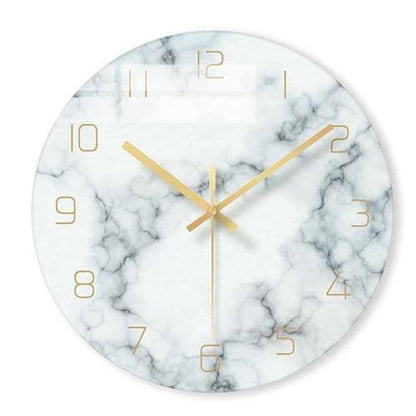 Marble-patterned wall clock with gold hands on a white background