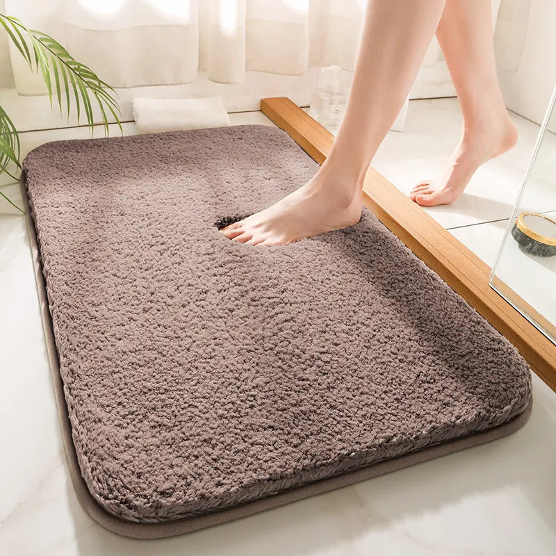 Person stepping onto a fluffy bath mat in a bathroom setting