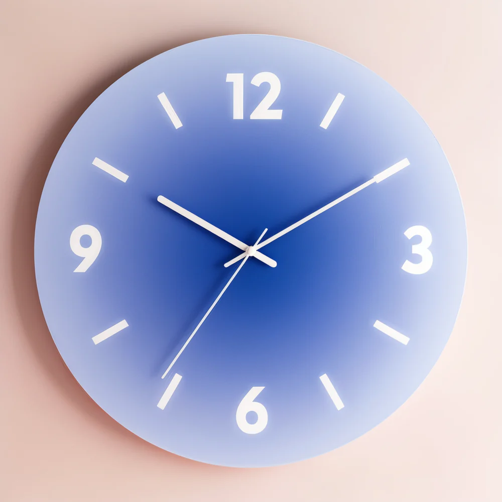 Blue gradient wall clock on a beige background
