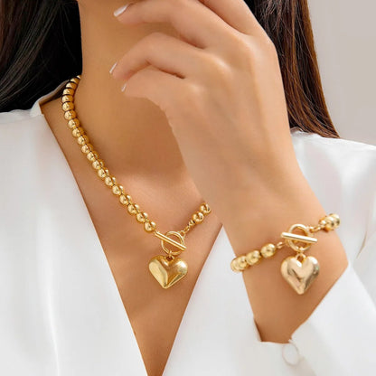 Ensemble bracelet et collier à breloques en forme de cœur perlé 