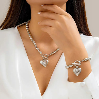 Ensemble bracelet et collier à breloques en forme de cœur perlé 