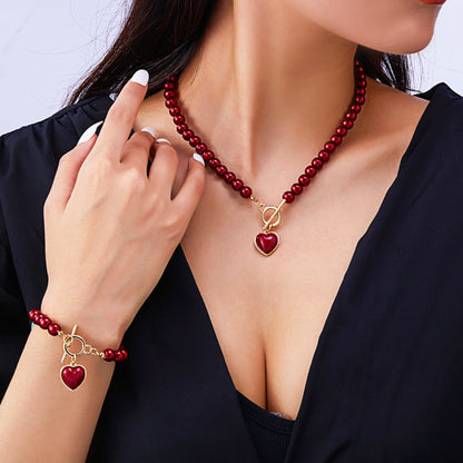 Ensemble bracelet et collier à breloques en forme de cœur perlé 