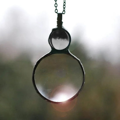 Joli collier pendentif loupe