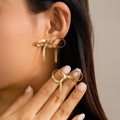 Boucles d'oreilles pendantes à nœud chic 