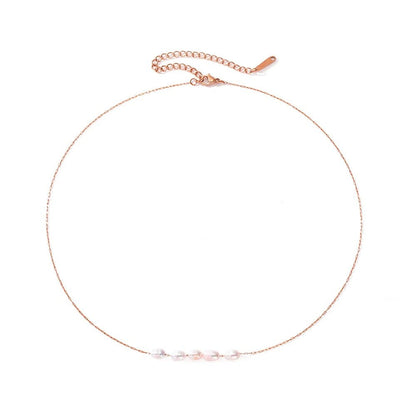 Collier ras du cou délicat à chaîne perlée 