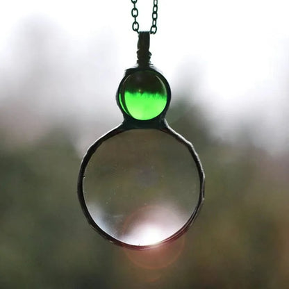 Joli collier pendentif loupe