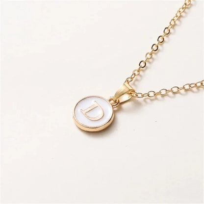 Collier pendentif cercle monogramme or de luxe