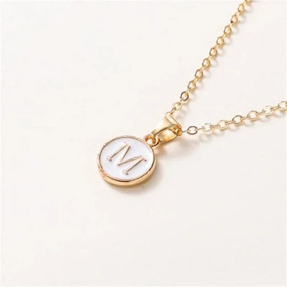 Collier pendentif cercle monogramme or de luxe