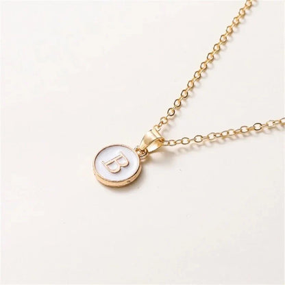 Collier pendentif cercle monogramme or de luxe