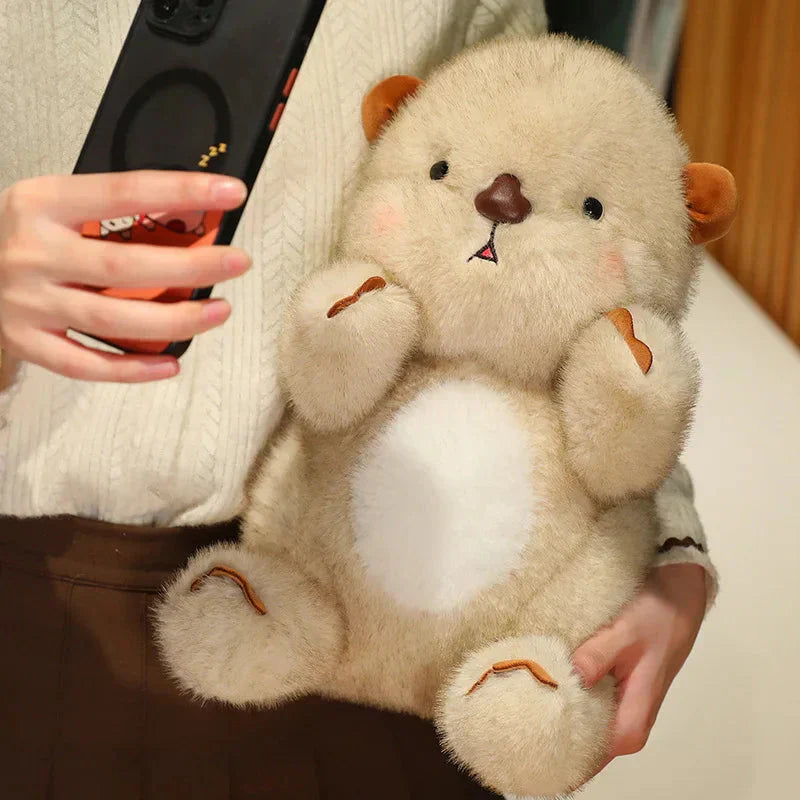 Adorable peluche loutre rose toute mignonne