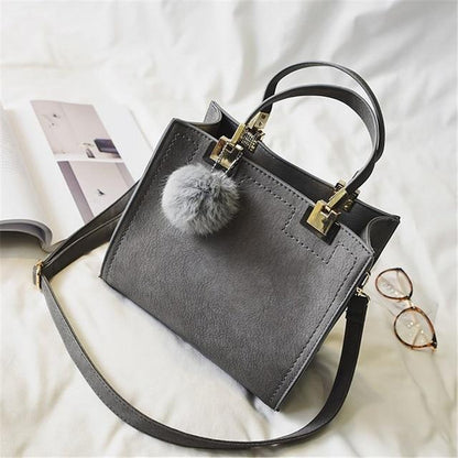 Sac cabas de luxe en cuir souple et fourrure avec pompon pour femme
